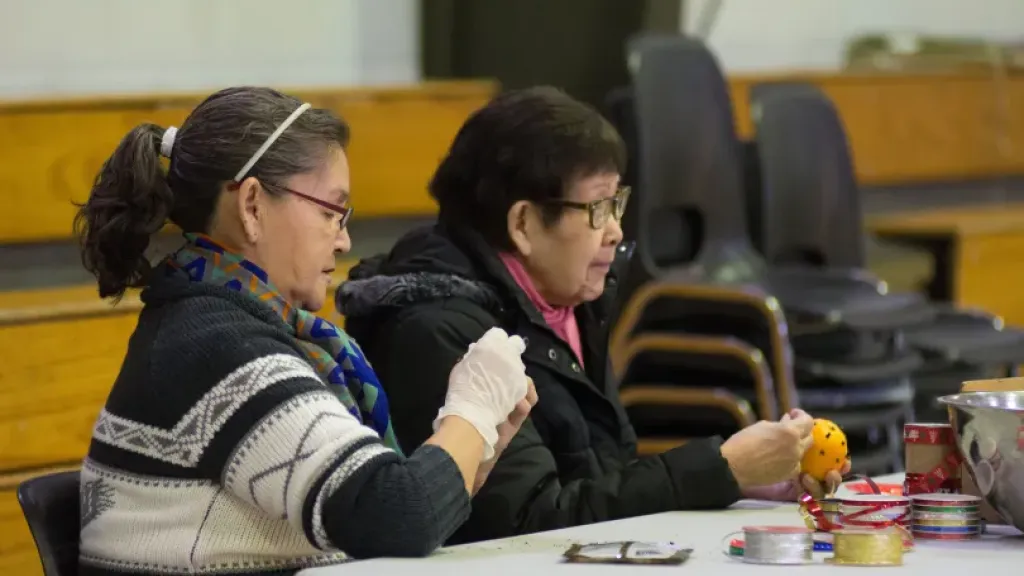 People sitting by a table
