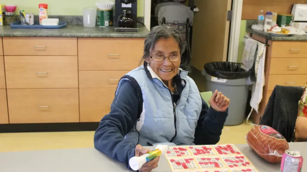 Person smiling while playing bingo